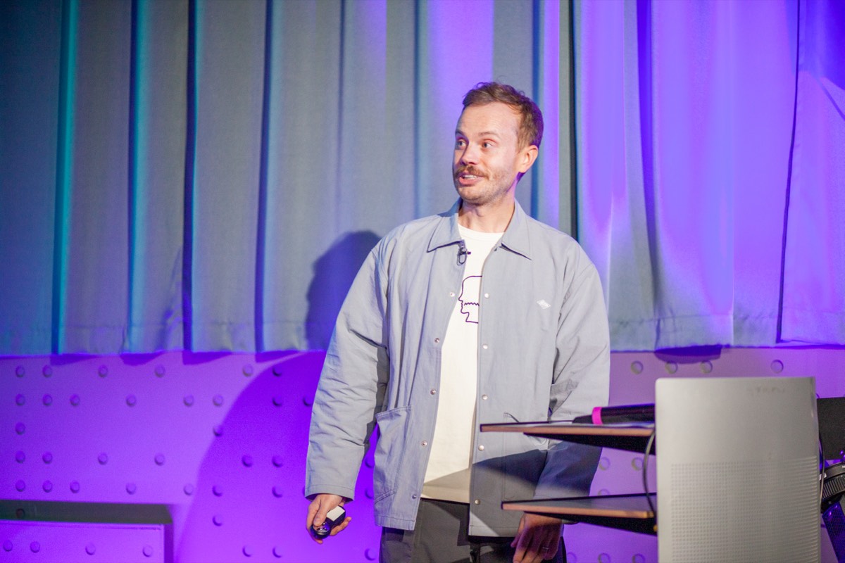 Maxwell Scott-Slade addressing the audience during his talk